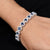 Elegant bracelet with round-cut ocean blue gems set in sterling silver for her.