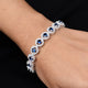 Elegant bracelet with round-cut ocean blue gems set in sterling silver for her.