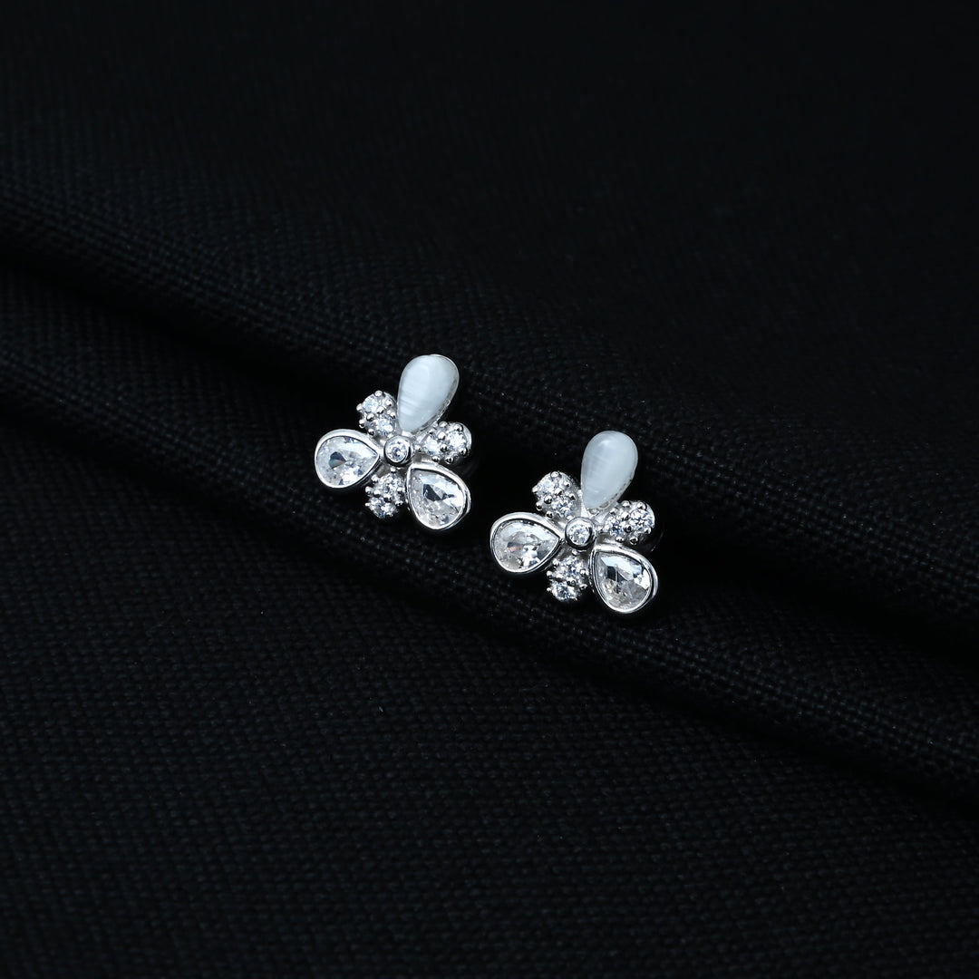 Stylish sterling silver earrings with a floral motif, opal, and gemstone accents