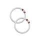 Silver baby kada with lavish red loops and spiral design.