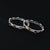 Beautiful silver bangles with heart designs and elegant gemstones.