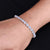 Elegant silver bracelet with a light blue gem, tailored for her.