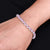 Elegant silver bracelet featuring pink gem stones, designed for ladies.