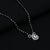 Elegant white gemstone mangalsutra with silver and black bead accents.