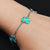 Sterling silver bracelet with attractive teal and blue butterfly design for girls.