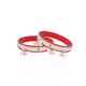 Elegant silver bangles with red accents for brides.