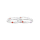 Silver bangles with red and purple gemstones.