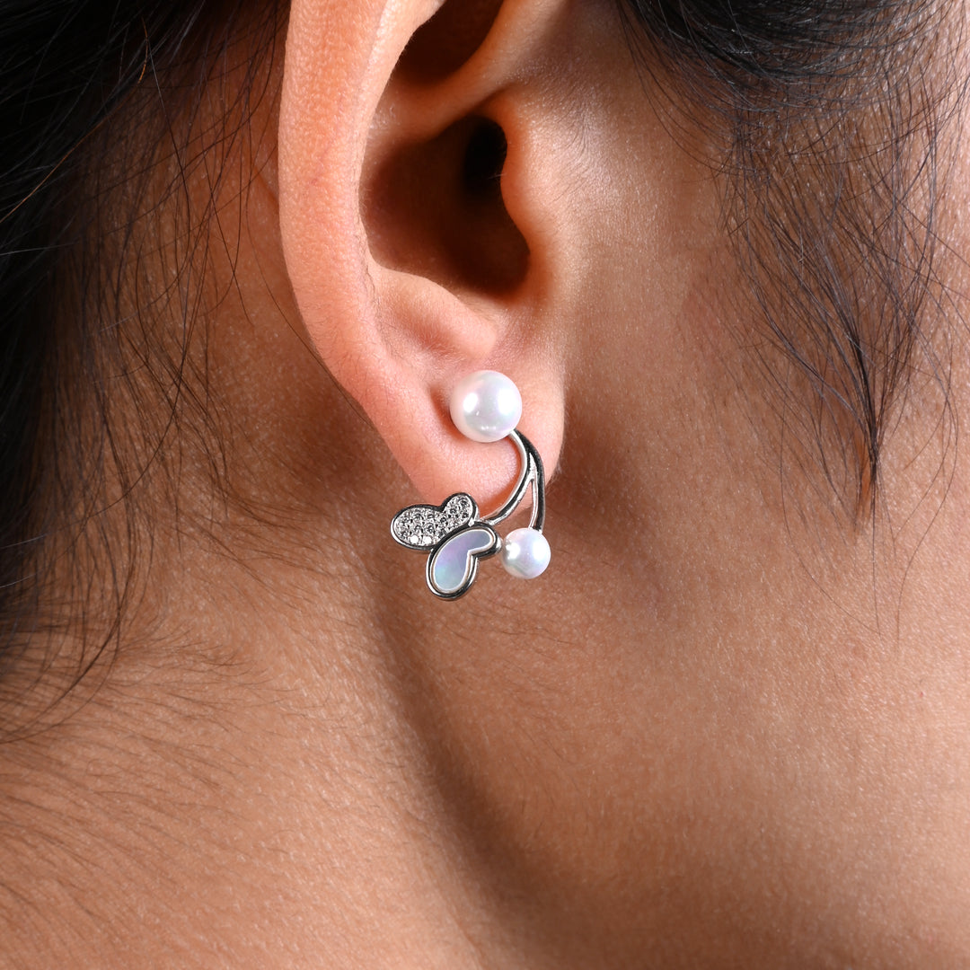 Charming Silver Earrings with Butterfly and White Moti Embellishment.