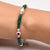 Elegant silver bracelet with a pink evil eye and accents of silver and green beads for girls.