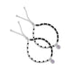 Girls' anklet featuring sterling silver, black beads, and oval purple stone.