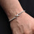 Boys' bracelet with a sleek sterling silver band and infinity symbol.