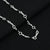 Boys' chain with a sleek silver design and black bead accents.