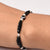 Elegant sterling silver bracelet with black evil eye design and beads for girls.