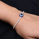 Elegant silver bracelet featuring a central round blue evil eye charm for boys.