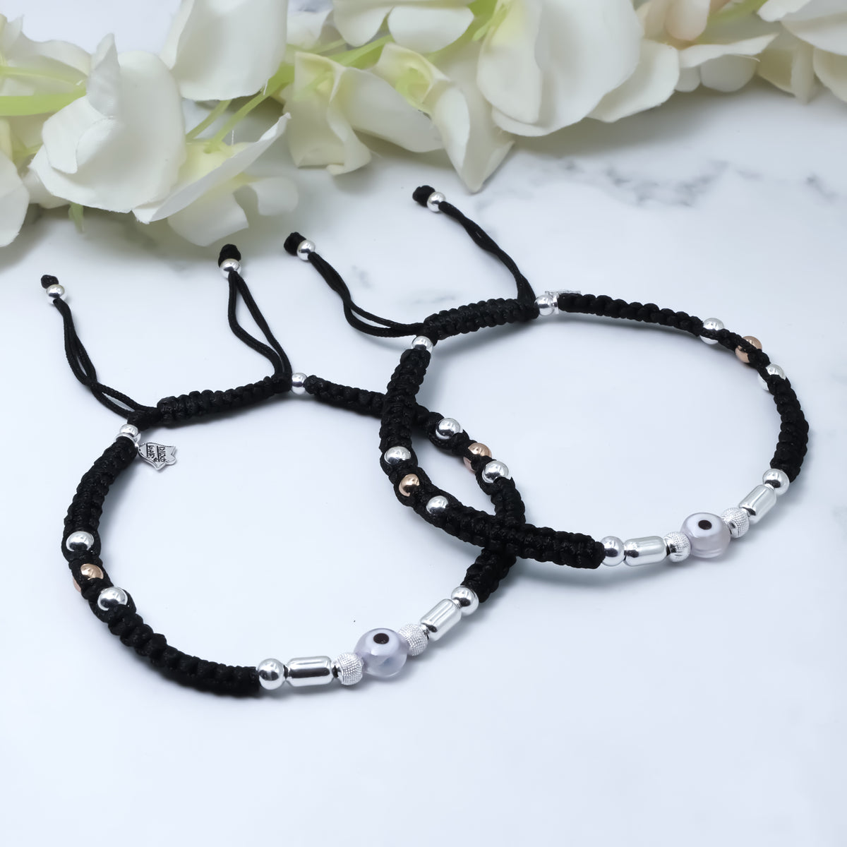 White evil eye thread anklet with silver buds