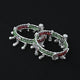 Stylish silver leg kada featuring vibrant green and red beads.