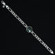 Stylish sterling silver bracelet with a prominent center green gem for boys.