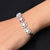 Elegant silver bracelet featuring a single white gem.