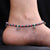 Beautiful pink and green beaded birds on silver anklets.