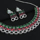 Elegant silver bridal set featuring gemstone necklace and matching earrings.