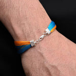Load image into Gallery viewer, Timeless silver moli bracelet with a striking blue and yellow pattern for a unique style
