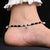 Elegant sterling silver anklet with black beads and silver balls.