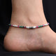 Elegant silver anklets with pink and green beads for girls.