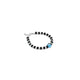 Elegant silver bracelet adorned with a light blue evil eye and black and silver beads.