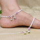 Elegant silver anklet featuring colorful beads and charming heart accents.