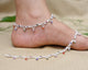 Silver anklet features colorful gems symbolizing the unity of love.