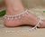 Elegant silver anklet featuring large beads complemented by stunning gems.