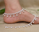 Elegant silver anklet featuring large beads complemented by stunning gems.