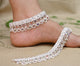 Elegant silver anklet featuring heavy colorful beads for a stunning bridal look.