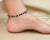 Silver anklet with circle and heart shape design for girls.