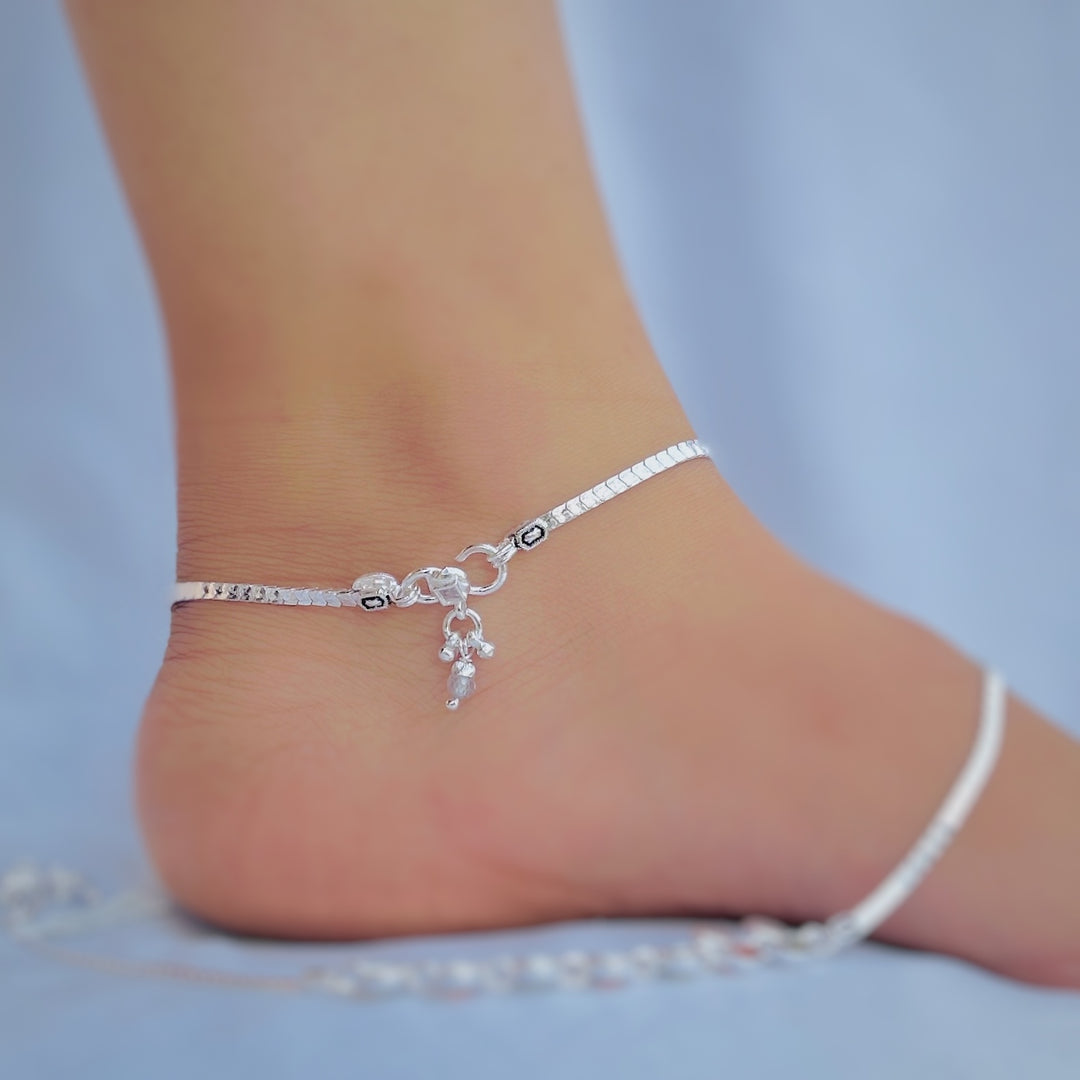 Silver anklet adorned with pink and blue heart stones, perfect for everyday use.