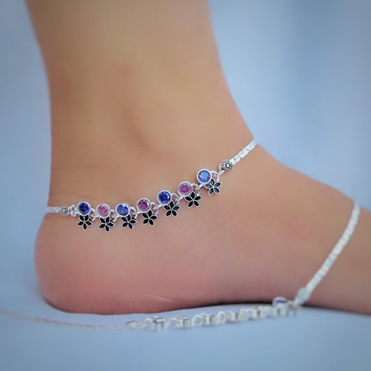 Stunning silver anklet featuring vibrant blue and pink stones.