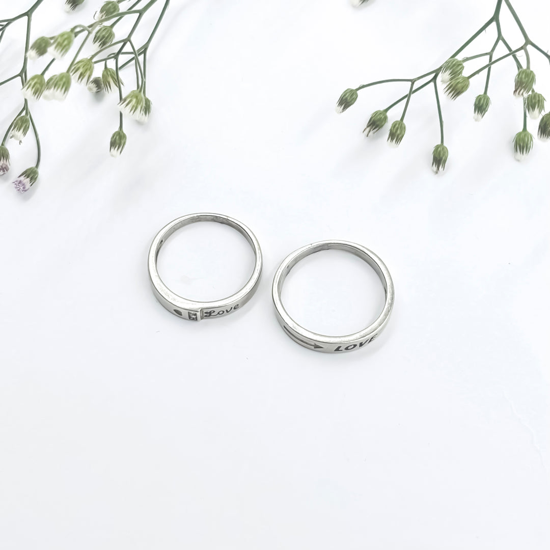 Unique Silver Couple Rings with Romantic "Love" Text at the Core.