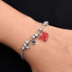 Boys' bracelet with a sterling silver band adorned with a red swan motif.