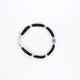 Sterling silver bracelet with blue evil eye charm and black beads for girls.