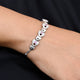 Stylish silver bracelet showcasing a connecting heart pattern, designed for girls.