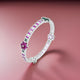 Elegant silver chudi featuring green and purple gem stones in flower patterns for girls.