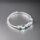 Charming silver kada featuring two evil eye motifs for boys.