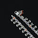 Trendy silver anklet with delightful floral designs for a feminine touch.