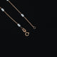 Refined silver beads combined with a rose gold linked chain.