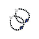 Silver bracelet with black and silver beads featuring a blue teddy bear design.