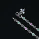 Trendy silver anklet with eye-catching heart shapes and colorful stones.