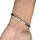 Stylish Cartier bracelet in silver with black details, designed for men and women.