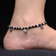 Elegant silver anklet with circle and heart shapes for girls.