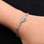 Boys' bracelet with a sterling silver band showcasing an evil eye and infinity motif.