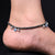 Elegant silver anklet featuring aqua blue heart.